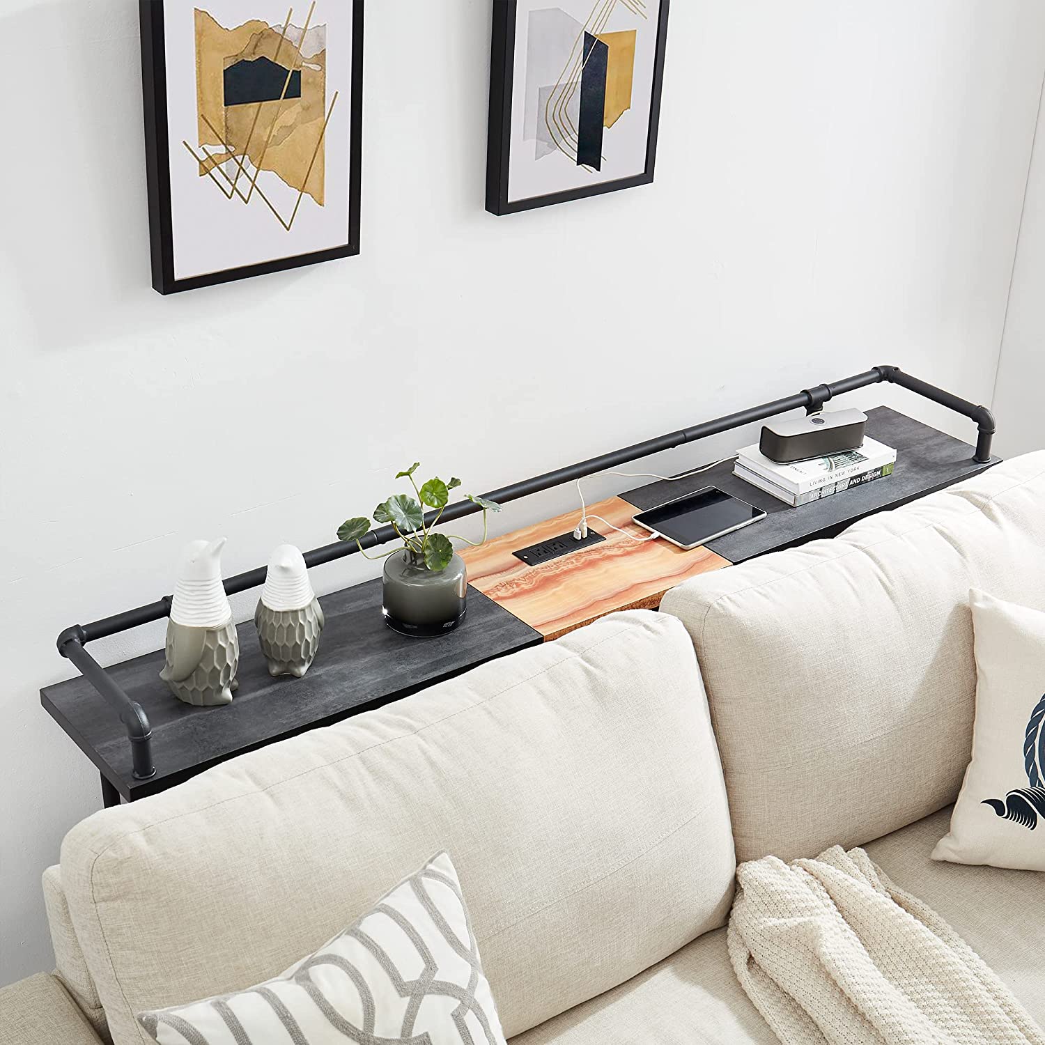 Narrow console shop table behind couch